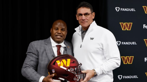Washington Commanders coaches Eric Bieniemy (left) and Ron Rivera (right).